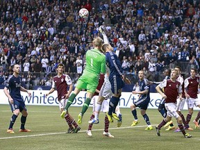 Goalkeeper David Ousted (in green) of the Vancouver Whitecaps joins the offence for a corner kick late in their 2-1 loss to the Colorado Rapids on Saturday at BC Place Stadium.