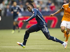 Darren Mattocks chases the ball during the Vancouver Whitecaps’ game against the Houston Dynamo iat BC Place Stadium on Saturday.