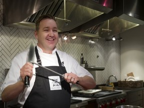 David Robertson, chef/owner at The Dirty Apron Cooking School in Vancouver hones his knife.