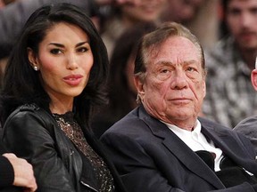 Los Angeles Clippers owner Donald Sterling and V. Stiviano (left) as they watch a December 2010 NBA game at the Staples Center in Los Angeles.