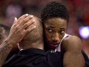 A dejected Toronto Raptor DeMar DeRozan gets a hug as he walks off the floor after losing Game 7 to the Brooklyn Nets in their first-round NBA playoff series at the Air Canada Centre in Toronto on Sunday.