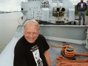 Tex Enemark of the B.C. Artificial Reef Society, looks out from the foredeck of the HMCS Yukon, a 366ft.  Restigouche-class destroyer bound for San Diego in 1999. Wes Roots in background.