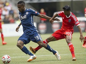 With his assured performance in the Whitecaps’ midfield on Saturday, Gershon Koffie (left) has done enough now to be the man in possession of the role rather than the man who was playing for the right to fill it.