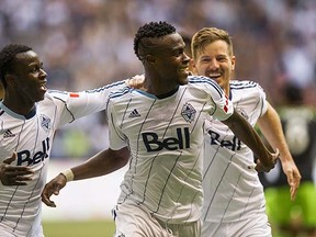 Midfielder Gershon Koffie (centre, celebrating his long-distance goal with Kekuta Manneh, left, and Jordan Harvey) had what was easily his best game yet as a Whitecap in Saturday's 2-2 draw against the visiting Seattle Sounders. (Gerry Kahrmann, PNG)