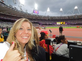 Dietitian Jennifer Gibson cheering her athletes on, in the stands at the 2012 Olympic Games in London