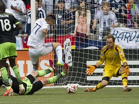 Vancouver Whitecaps midfielder Pedro Morales (driving to the net against Seattle Sounders goalkeeper Stefan Frei last Saturday’s game) has delivered some magical moments with the ball at his feet so far this season. (Gerry Kahrmann, PNG)