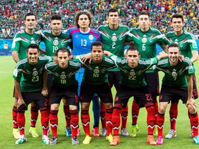 Mexico's soccer team poses for a photo at the 2014 World Cup.