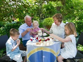 Whysalls with grandchildren having a tea party to celebrate Garden Day.