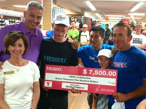 John Stanton, right, the CEO and founder of The Running Room, has played a big role over the years in raising funds for charity through his store's many sponsored running events.