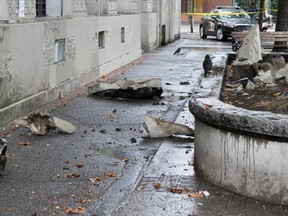 Large broken pieces of a building lie in Pigeon Park in Vancouver.
(Photo by Wayne Leidenfrost/PNG)