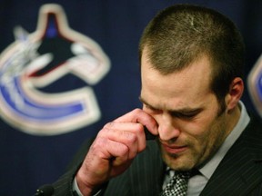 VANCOUVER - MARCH 10:   Todd Bertuzzi of the Vancouver Canucks talks to the media prior to start of the  the Canuck's NHL game against the Minnesota Wild at General Motors Place on March 10, 2004 in Vancouver, Canada.  Bertuzzi faced an NHL disciplinary hearing today in Toronto for his hit on Colorado Avalanche's Steve Moore March 8 in Vancouver.  Moore suffered a broken neck, facial cuts and a concussion from the incident that could leave Bertuzzi suspended for the remainder of the 2003-04 season.  (Photo by Jeff Vinnick/Getty Images)