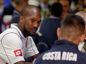 Costa Rican national soccer player Kendall Waston (L) attends a dinner hosted by the president for the soccer team ahead of their friendly matches in the United States at the Presidential House in San Jose on May 28, 2014.    AFP PHOTO / EZEQUIEL BECERRA/Getty Images