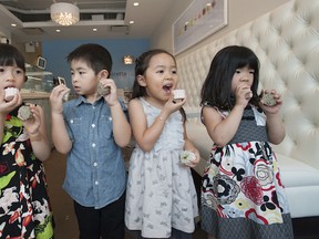Left to right:  Mia Chow, Ethan Chow, Adrienne Ma and Hailey Co with moon cakes inside Soirette