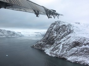 A look at the entrance to Grise Fiord, Nunavut from under the plane wing.