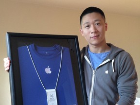 Sam Sung with his framed Apple business card, t-shirt and lanyard. It could all be yours ... if you want to spend more than $80,000.