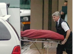 Coroner removes one of the bodies from the Balmoral on Oct. 21, 2007