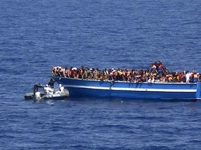 More asylum-seekers entering Europe from Africa and the Middle East are claiming they are "Christians" and will be persecuted if they're returned to their Islamic homelands. Two religion writers, from Italy and Norway, suggested it's hard for refugee boards to determine the truth.  Photo shows desperate asylum seekers crossing the Mediterranean Sea this year in smugglers' boats.