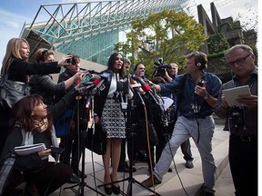 Eileen Mohan, centre, speaks to the media outside B.C. Supreme Court after Cody Haevischer and Matthew Johnston were found guilty of first-degree murder and conspiracy to commit murder in the gang slayings of six people, at the "Surrey Six" murder trial