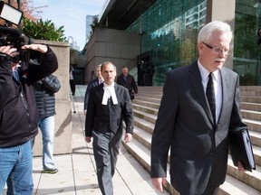 Crown spokesman Neil MacKenzie, right, and lead prosecutor Mark Levitz, centre