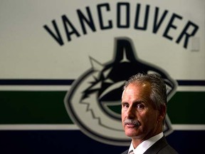 Vancouver Canucks' head coach Willie Desjardins stands for television interviews after he was hired by the NHL hockey team in Vancouver, B.C., on Monday June 23, 2014.