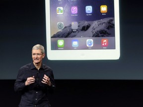 Apple CEO Tim Cook introduces the new Apple iPad Air 2 during an event at Apple headquarters on Thursday.