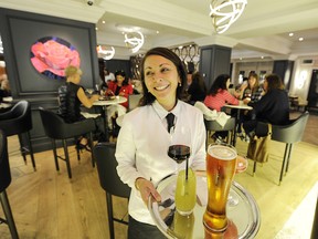 Vancouver B.C. October 1, 2014   Dinners enjoy the ambience inside Boulevard, a new stylish  restaurant  (where Fleuri operated) at the Sutton Place Hotel.   in Vancouver on October 1, 2014.
(Here** Jacqueline Inniger with colourful drinks in the --new "champagne lounge")


 Mark van Manen/PNG Staff
Photographer

see  Mia Stainsby Vancouver Sun   Restaurant Features and WEB