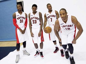 Toronto Raptors Terrence Ross, Lou Williams, Kyle Lowry and DeMar DeRozan (left to right) joke around while posing for photos at the team's media day last month. Raptors stars like Lowry and DeRozan are being looked to to lead the way in getting the club back into the NBA playoffs in this, their 20th season in the league. (Darren Calabrese, Canadian Press)