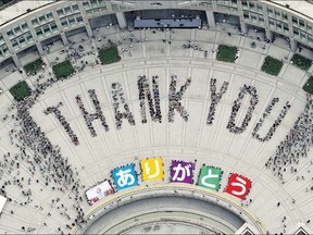 The online "Gratitude Challenge" asks people to express their thankfulness -- and positive psychology backs up the healthy aspects of a grateful heart. In this photo Tokyo citizens form an outdoor 'Thank you."