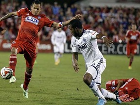 FC Dallas's Blas Perez (left) controls the ball againstVancouver Whitecaps centre back Kendall Waston during last week’s 2-1 heart-breaking (for the Whitecaps) MLS playoff loss in Frisco, Texas. (Tony Gutierrez, Associated Press)