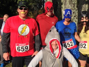 Flash Gordo of The Vancouver Sun joins some Mo Miler super heroes before the starting gun went off at Stanley Park on Saturday. It was the only time they were this close together in the 5K race!