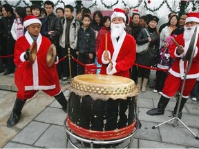 One way Chinese people mark Christmas is through secular/consumer excitement. A second form is cultural suspicion or perhaps indifference. A third manifestation of Christmas for many Chinese people centres on Christian devotion. Photo shows a street performance in China.