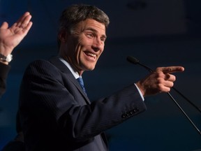 Vancouver Mayor Gregor Robertson gestures while addressing supporters after being elected for a third term during a civic election in Vancouver, B.C., on Saturday November 15, 2014. THE CANADIAN PRESS/Darryl Dyck
