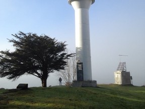 Lighthouse on Mayne Island with fog obscuring the water views