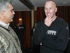 Then-San Francisco 49ers quarterback Jeff Garcia (right) with former B.C. Lions head coach Wally Buono in 2003. The duo teamed up in Calgary for several seasons, winning a Grey Cup championship together in 1998. (Richard Lam, Vancouver Sun files)