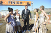 Jillian (left) â in a rare moment fully clothed with no accompanying black bar on her butt â after winning the mud race. Photo/ABC