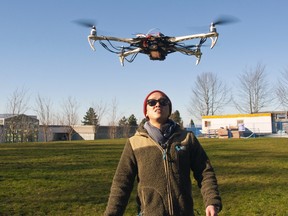 SFU student Mark Anthony Wijaya with Avian Drone
