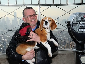 Handler William Alexander and dog Miss P pose for a photo during "Best In Show Winner" Miss P of the 139th Westminster Kennel Club Dog Show at The Empire State Building on February 18, 2015 in New York City.  (Photo by Andrew Toth/Getty Images)
