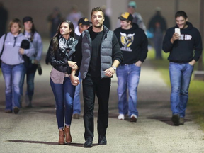 Chris and Jade leaving the high school stadium in Arlington after watching a football game.