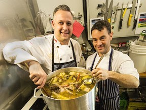 Home on the Range Organics Allen Ingram (left) and James Day stirring pots of broth at their store