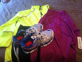 My sweet New Balance running gear, including a zip-up neon yellow jacket with glow-in-the-dark beads, new running shoes, running tights and a partial-zip long-sleeve shirt (all with breathable, moisture-wicking fabrics).