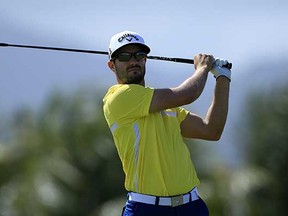 Adam Hadwin plays his shot from the ninth tee during the second round of the Puerto Rico Open earlier this month in Rio Grande, Puerto Rico. (Michael Cohen, Getty Images)