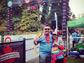 Scott and I sweaty, but happy at the finish. We ran our 8K race in 54 minutes1