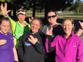 Langley runners flash the Vulcan salute after trekking through the winding trails on Saturday morning as part of the Sun Run InTraining clinic. Some of them moved at warp speed — those who didn't missed the photo-op!