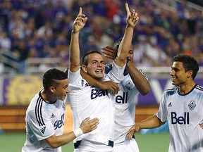 Vancouver Whitecaps striker Octavio Rivero shows Orlando fans who’s No. 1 after his 96th-minute winner against Orlando City SC in MLS action on Saturday. (Reinhold Matay, USA Today Sports)