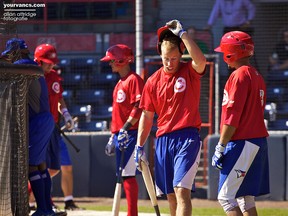 Brendan Kalfus takes a break during batting practice