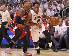 DeMar DeRozan of the Toronto Raptors tries to drive around Bradley Beal of the Washington Wizards during Game 1 of their NBA first-round playoff series at the Air Canada Centre in Toronto on Saturday. (Claus Andersen, Getty Images)