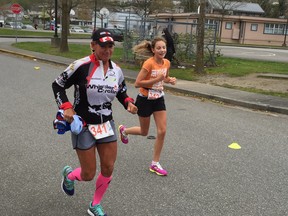 Leigh-Ann Vauderlinde, left, and Sheigh Gaudette, both of Mission, head toward the finish line in Sunday's Heritage to Hatzic 5K and 10K road race.