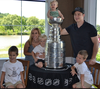 Nicole and Dustin Brown, with their four children.
