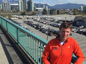 Tim Hopkins, who has been race director of the Sun Run for the past 10 years, relaxes on top of Cambie Bridge — the final hill of the scenic 10K course and the finishing stretch to BC Place Stadium.