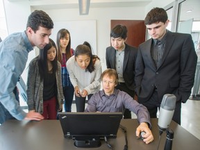 Sauder School of Business Professor Cameron Morrell teaches students in a media lab at UBC in Vancouver. With the help of technology company Panopto, the school set up pop-up media labs using old monitors and computers ,and launched a new mandatory course for students. Students, from left: Omri Wallach, Elizabeth Wong, Adrienne Tan, Mikaela Wang, Ernest Fung and Franck Benichou.